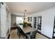 Bright dining room with a chandelier, table, and chairs; hardwood floors throughout at 255 Mcintosh Estates Dr, Sharpsburg, GA 30277