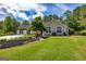 Charming one-story home with a beautifully landscaped front yard and inviting curb appeal at 255 Mcintosh Estates Dr, Sharpsburg, GA 30277