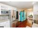 Bright kitchen featuring stainless steel appliances, granite countertops, and mosaic tile backsplash at 255 Mcintosh Estates Dr, Sharpsburg, GA 30277