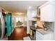 Bright kitchen featuring stainless steel appliances, granite countertops, and opens to dining room at 255 Mcintosh Estates Dr, Sharpsburg, GA 30277