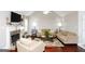 Inviting living room features a stone fireplace, vaulted ceilings, and ample seating at 255 Mcintosh Estates Dr, Sharpsburg, GA 30277