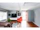 Bright living room with stylish decor, a ceiling fan, and an open doorway, creating an inviting space at 255 Mcintosh Estates Dr, Sharpsburg, GA 30277