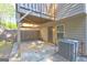 Private patio with an air conditioning unit and a fenced yard for outdoor enjoyment at 1005 Belfry Ter, Fairburn, GA 30213