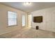 Spacious bedroom with a large window, private door, and TV at 1005 Belfry Ter, Fairburn, GA 30213
