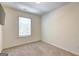 Neutral bedroom with cozy carpet and a window for natural light at 1005 Belfry Ter, Fairburn, GA 30213