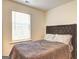Comfortable bedroom featuring plush bedding and a large window providing plenty of natural light at 1005 Belfry Ter, Fairburn, GA 30213