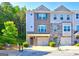 Charming townhome with brick facade, attached garages, well-maintained landscaping and inviting curb appeal at 1005 Belfry Ter, Fairburn, GA 30213