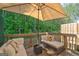Relaxing outdoor patio with comfortable seating and a beautiful view of lush greenery at 1005 Belfry Ter, Fairburn, GA 30213