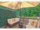 Relaxing outdoor patio with comfortable seating and a beautiful view of lush greenery at 1005 Belfry Ter, Fairburn, GA 30213