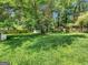 Lush backyard with mature trees provides a private outdoor retreat at 3059 Will Rogers Se Pl, Atlanta, GA 30316