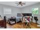 Functional bedroom featuring hardwood floors, a ceiling fan, and practical layout suited to modern living at 3059 Will Rogers Se Pl, Atlanta, GA 30316