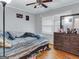 Cozy bedroom features a ceiling fan and hard wood floors at 3059 Will Rogers Se Pl, Atlanta, GA 30316