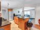 Open-concept kitchen with granite countertops, stainless steel appliances, and access to both the living and dining spaces at 3059 Will Rogers Se Pl, Atlanta, GA 30316