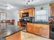 Fully equipped kitchen featuring plenty of storage space, modern appliances, and stylish backsplash tiles for modern living at 3059 Will Rogers Se Pl, Atlanta, GA 30316
