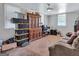Finished basement area with vintage wooden cabinet and brown carpet at 3059 Will Rogers Se Pl, Atlanta, GA 30316