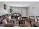 Inviting living room with neutral paint, dark couches and plush accent pillows at 3059 Will Rogers Se Pl, Atlanta, GA 30316