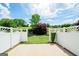 Backyard featuring a patio, privacy fence, green grass, and landscaping at 335 Grand Teton Cir, Fayetteville, GA 30215