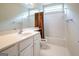 Well-lit bathroom with a tub and shower and vanity with white cabinetry at 335 Grand Teton Cir, Fayetteville, GA 30215