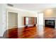 Open-concept living room with hardwood floors and fireplace at 335 Grand Teton Cir, Fayetteville, GA 30215