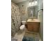 Bathroom features a neutral color scheme, single vanity, and a shower with a decorative curtain at 3146 Weymouth Dr, Marietta, GA 30062