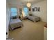 Bright bedroom with twin beds, large windows, and neutral decor at 3146 Weymouth Dr, Marietta, GA 30062