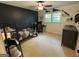 Comfortable bedroom with a sleek dark wall, bed, desk, and ceiling fan at 3146 Weymouth Dr, Marietta, GA 30062