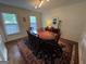 Formal dining room with classic wainscoting, traditional rug, and seating for eight at 3146 Weymouth Dr, Marietta, GA 30062