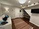 Cozy living room with a comfortable couch, colorful rug, and a wall-mounted television at 3146 Weymouth Dr, Marietta, GA 30062