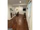Open living space featuring hardwood floors, large mirrors, and convenient access to workout equipment at 3146 Weymouth Dr, Marietta, GA 30062