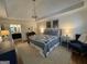 Main bedroom features a blue bedspread, hardwood floors, and a connected bathroom at 3146 Weymouth Dr, Marietta, GA 30062