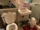 Tight bathroom featuring a toilet, sink, and shower in need of cleaning at 4116 Warrior Trl, Stone Mountain, GA 30083