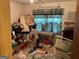 View of messy bedroom with a window at 4116 Warrior Trl, Stone Mountain, GA 30083