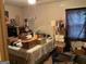 Cluttered bedroom with lots of boxes and a white headboard bed in need of tidying at 4116 Warrior Trl, Stone Mountain, GA 30083