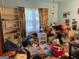 View of messy bedroom with a window and bookshelf at 4116 Warrior Trl, Stone Mountain, GA 30083