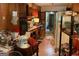 Dated eat-in kitchen with wood cabinets and appliances, and access to another room at 4116 Warrior Trl, Stone Mountain, GA 30083