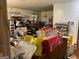 Untidy living room filled with boxes and clutter, showcasing its spacious layout at 4116 Warrior Trl, Stone Mountain, GA 30083