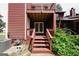 Back porch with wooden steps, railings, and double doors at 5461 Park S Pl, Atlanta, GA 30349