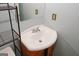 This bathroom features a corner sink and shelf next to the toilet at 5461 Park S Pl, Atlanta, GA 30349