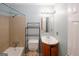 This is a well lit bathroom showing a shower-tub combo and stylish vanity at 5461 Park S Pl, Atlanta, GA 30349