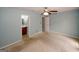 Comfortable bedroom showing entrance to ensuite bathroom and hallway at 5461 Park S Pl, Atlanta, GA 30349