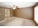 Bedroom with ceiling fan and adjoining bathroom with natural light at 5461 Park S Pl, Atlanta, GA 30349