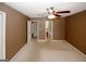 Spacious bedroom featuring ensuite bathroom and ceiling fan at 5461 Park S Pl, Atlanta, GA 30349