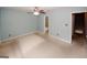 Comfortable bedroom boasts a ceiling fan and ensuite bathroom at 5461 Park S Pl, Atlanta, GA 30349