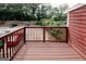 Deck overlooking the parking area and mature trees at 5461 Park S Pl, Atlanta, GA 30349