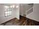 Bright dining room offering new floors, fresh paint, with stairway access at 5461 Park S Pl, Atlanta, GA 30349