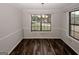 Dining area featuring fresh neutral paint, new flooring, and natural light at 5461 Park S Pl, Atlanta, GA 30349