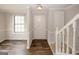 Inviting entryway boasts new flooring, fresh paint, and convenient access to the upper level at 5461 Park S Pl, Atlanta, GA 30349