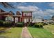 Charming townhome featuring a lush green lawn and beautiful landscaping at 5461 Park S Pl, Atlanta, GA 30349
