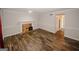 Bright living room features wood floors and a cozy brick fireplace at 5461 Park S Pl, Atlanta, GA 30349
