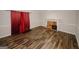 Spacious living room showcasing hardwood floors and a classic brick fireplace at 5461 Park S Pl, Atlanta, GA 30349